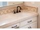 Bathroom vanity features a neutral countertop, patterned backsplash, and modern faucet at 22208 N San Ramon Dr, Sun City West, AZ 85375