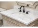 Vanity with custom cabinets, marble countertop, and oil rubbed bronze faucet at 22208 N San Ramon Dr, Sun City West, AZ 85375