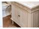 Bathroom vanity with marble countertop, custom cabinets, and black hardware at 22208 N San Ramon Dr, Sun City West, AZ 85375