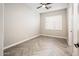 Neutral room showcasing shuttered windows, neutral walls, and herringbone-patterned wood floors at 22208 N San Ramon Dr, Sun City West, AZ 85375