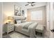 This bedroom features natural light, a decorative ceiling fan, and herringbone wood floors at 22208 N San Ramon Dr, Sun City West, AZ 85375
