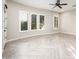 Spacious bedroom with wood floors and plantation shutters at 22208 N San Ramon Dr, Sun City West, AZ 85375