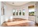 Bright breakfast nook with multiple windows and access to the outdoor spaces at 22208 N San Ramon Dr, Sun City West, AZ 85375