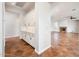 Butlers pantry with custom cabinets, granite countertop, and view to living room at 22208 N San Ramon Dr, Sun City West, AZ 85375