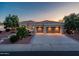 Charming home with a tiled roof, desert landscaping, and a large three-car garage at 22208 N San Ramon Dr, Sun City West, AZ 85375