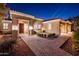 Inviting front entrance with manicured bushes, and brick-paved walkway enhancing curb appeal at 22208 N San Ramon Dr, Sun City West, AZ 85375