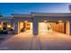 Spacious two-car garage with built-in storage cabinets and high ceilings at 22208 N San Ramon Dr, Sun City West, AZ 85375
