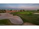 Beautiful aerial view of golf course features pristine greens, sand traps and luxury homes at 22208 N San Ramon Dr, Sun City West, AZ 85375