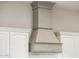 Kitchen range hood with custom woodwork at 22208 N San Ramon Dr, Sun City West, AZ 85375