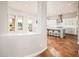 Bright kitchen area with white cabinets and a view of the backyard at 22208 N San Ramon Dr, Sun City West, AZ 85375