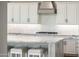 Kitchen with white cabinets, stone counters, and stainless appliances at 22208 N San Ramon Dr, Sun City West, AZ 85375