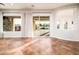 Bright, open-plan living room with a view to the patio and kitchen at 22208 N San Ramon Dr, Sun City West, AZ 85375