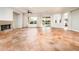 Bright living room with large windows, tile floors, fireplace, and ample natural light at 22208 N San Ramon Dr, Sun City West, AZ 85375
