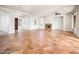 Spacious living room featuring tile flooring, fireplace, and large windows offering abundant natural light at 22208 N San Ramon Dr, Sun City West, AZ 85375