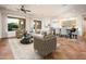 Open living room with neutral decor, including dining and seating areas at 22208 N San Ramon Dr, Sun City West, AZ 85375