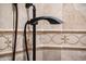 Shower head with tile surround and decorative border at 22208 N San Ramon Dr, Sun City West, AZ 85375