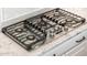 The kitchen has a stovetop with a sleek design and stainless steel finish at 22208 N San Ramon Dr, Sun City West, AZ 85375