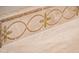 Close-up of neutral-toned, decorative tile design at 22208 N San Ramon Dr, Sun City West, AZ 85375
