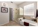 Modern bathroom with glass shower, separate tub, and tiled floors at 22232 N 48Th St, Phoenix, AZ 85054