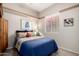 Comfortable bedroom featuring a cozy bed with plush pillows and a window overlooking the neighborhood at 22232 N 48Th St, Phoenix, AZ 85054