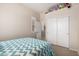 Comfortable bedroom offering a large closet, neutral paint, and a cozy bed with colorful accents at 22232 N 48Th St, Phoenix, AZ 85054