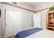 Bedroom with neutral paint, closet, and view to open door to the rest of the house at 22232 N 48Th St, Phoenix, AZ 85054