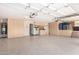 Spacious garage featuring ample storage cabinets, epoxy flooring, and a modern overhead door system at 22232 N 48Th St, Phoenix, AZ 85054