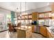 Charming kitchen with stainless steel appliances, granite island, and an adjacent breakfast area at 22232 N 48Th St, Phoenix, AZ 85054