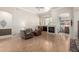Bright living room with a fireplace, high ceilings, wood floors, neutral walls and an open layout perfect for gatherings at 22232 N 48Th St, Phoenix, AZ 85054