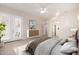 Spacious main bedroom with French doors, ceiling fan, neutral color palette, and ensuite bathroom at 22232 N 48Th St, Phoenix, AZ 85054