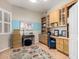 Home office featuring custom cabinets, built-in bookshelves, and ample space for a desk at 22232 N 48Th St, Phoenix, AZ 85054