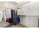 Spacious walk-in closet with ample storage, shelving and hanging space, perfect for organizing your wardrobe at 22232 N 48Th St, Phoenix, AZ 85054