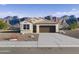 Charming single-story home with neutral exterior, desert landscaping and large front-facing garage at 22540 N Lynn St, Maricopa, AZ 85138