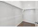 Walk-in closet with ample shelving and storage space at 22540 N Lynn St, Maricopa, AZ 85138