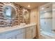 Bathroom features a dual sink vanity, mosaic tile backsplash, and glass enclosed shower at 2320 S Forest Ave, Tempe, AZ 85282