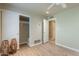 Bedroom with wood-look floors, closet with sliding doors, and attached bathroom at 2320 S Forest Ave, Tempe, AZ 85282