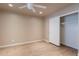 Bright bedroom features wood floors, ceiling fan, and closet with sliding door at 2320 S Forest Ave, Tempe, AZ 85282