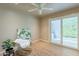 Bedroom with wood floors and sliding glass doors leading to the outside at 2320 S Forest Ave, Tempe, AZ 85282