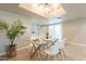Bright dining area featuring modern lighting, a glass table, and backyard access at 2320 S Forest Ave, Tempe, AZ 85282