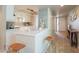 Eat-in kitchen features bar seating, pendant lighting, and light and bright finishes at 2320 S Forest Ave, Tempe, AZ 85282