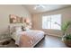Bright bedroom boasts a large window, vaulted ceilings, and modern decor at 2320 S Forest Ave, Tempe, AZ 85282