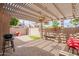 A covered patio area is perfect for outdoor dining and entertaining at 2320 S Forest Ave, Tempe, AZ 85282