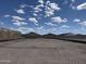 Picture of a new construction backyard with block fencing under a beautiful sky at 24113 W Bowker St, Buckeye, AZ 85326