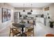 Eat-in kitchen with stainless steel appliances, light cabinetry, and pendant lighting at 2463 W Rowel Rd, Phoenix, AZ 85085