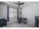Bedroom featuring a window, ceiling fan, and furniture at 26017 W Maple Dr, Buckeye, AZ 85396