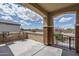 Charming covered patio featuring comfortable seating, perfect for relaxing and enjoying the serene outdoor view at 26017 W Maple Dr, Buckeye, AZ 85396