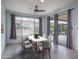 Inviting dining area featuring a modern table set and views of the outdoor patio at 26017 W Maple Dr, Buckeye, AZ 85396
