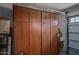 Spacious garage featuring ample built-in wood cabinets for optimal storage solutions and organization at 26017 W Maple Dr, Buckeye, AZ 85396