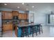 Modern kitchen with granite countertops, stainless steel appliances, and ample cabinet space at 26017 W Maple Dr, Buckeye, AZ 85396