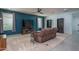 Cozy living room featuring a fireplace, entertainment center, and neutral color palette for a relaxing ambiance at 26017 W Maple Dr, Buckeye, AZ 85396